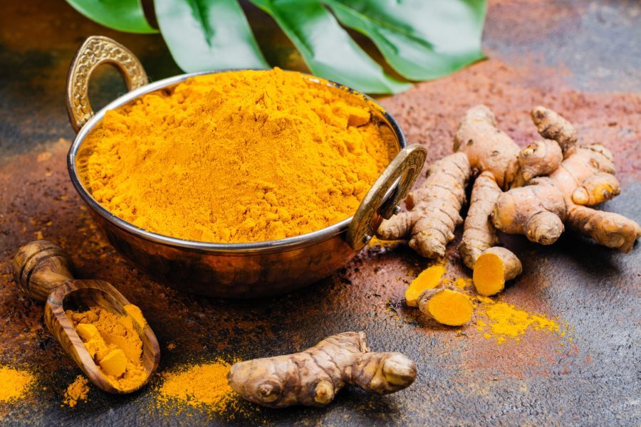 Turmeric,Powder,And,Fresh,Root,On,Grunge,Background